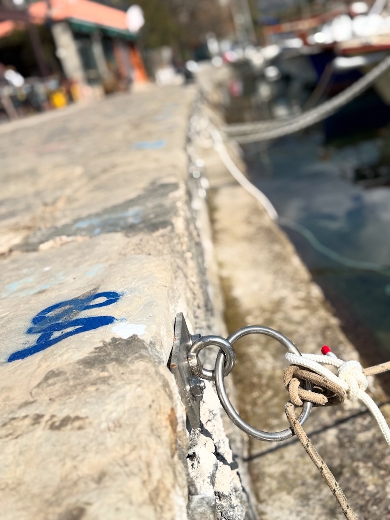 The installation of new mooring lines and rings on Pier C 